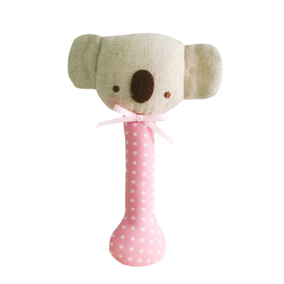 Koala-shaped toy with a pink polka dot handle on a white background