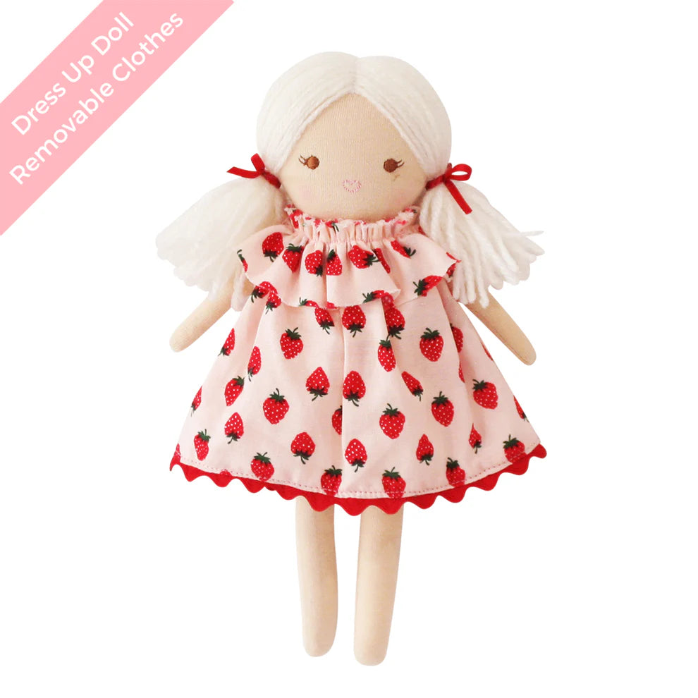Doll with strawberry-patterned dress on a white background