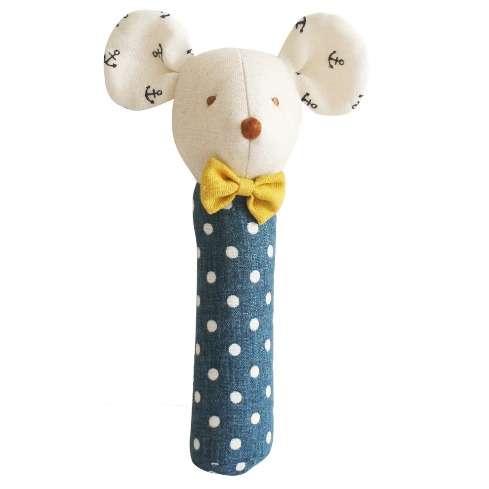 Stuffed toy mouse with a yellow bow tie and blue polka dot body on a white background