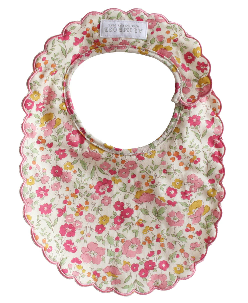 Alimrose Scallop Bib Rose Garden. Floral patterned baby bib on a white background