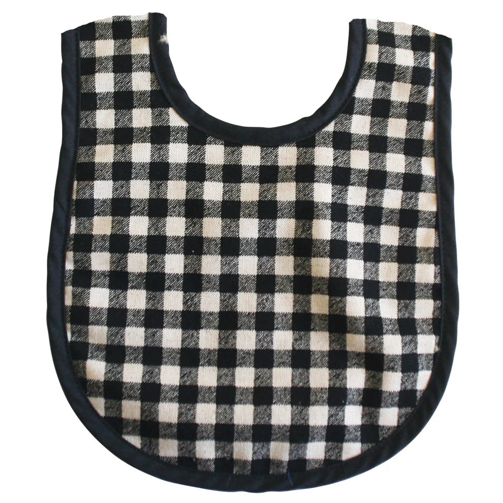 Alimrose Bib Black Check Linen. Black and white checkered baby bib on a white background