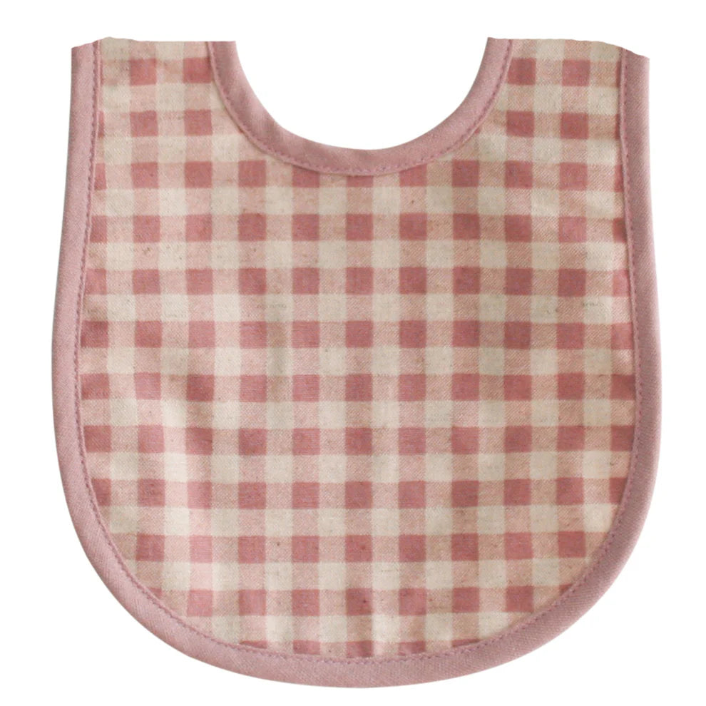 Alimrose Bib Rose Check Linen. Pink and white checkered baby bib on a white background