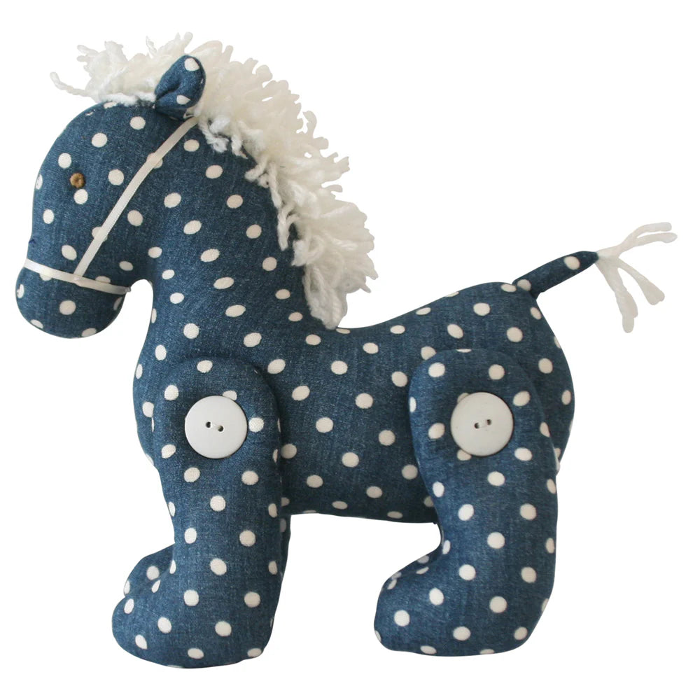 Stuffed horse toy with blue and white polka dot pattern on a white background