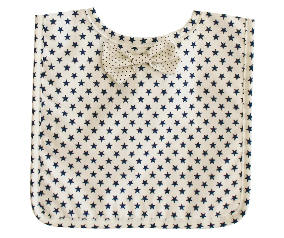 Alimrose Bow Tie Bib White Navy Star. Folded bib with star pattern on a white background