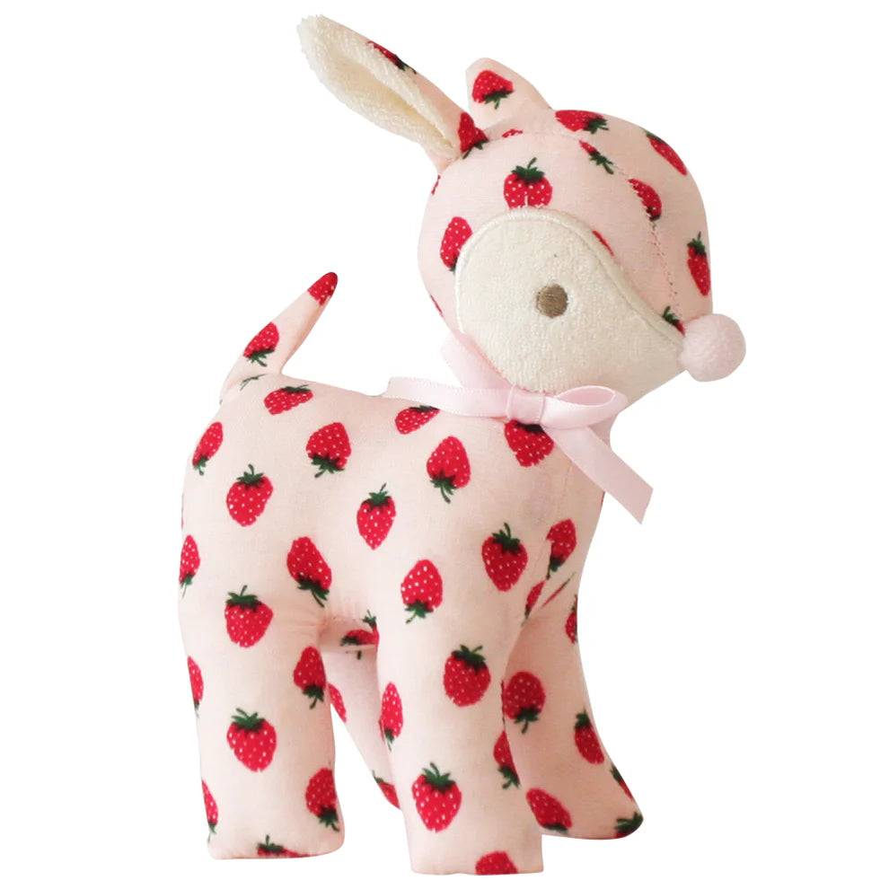 Stuffed animal with strawberry pattern on a white background