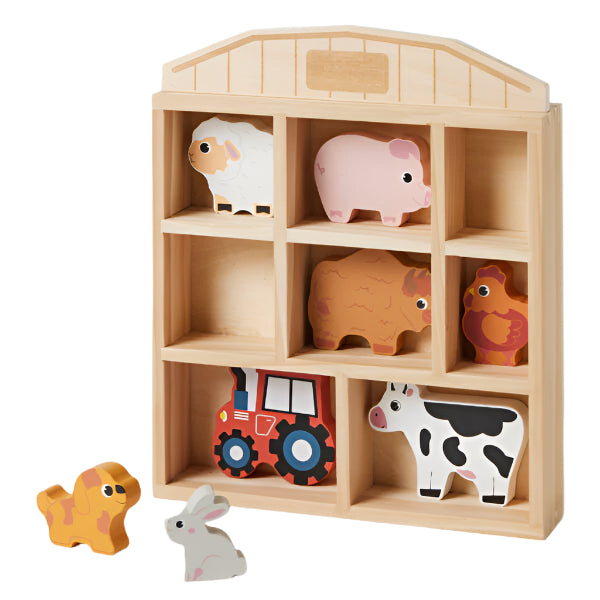 Farm Fun Animals Set. A set of farm animals including a pig, sheep, chicken, cow, and a tractor, stored in a wooden farmhouse-shaped display.
