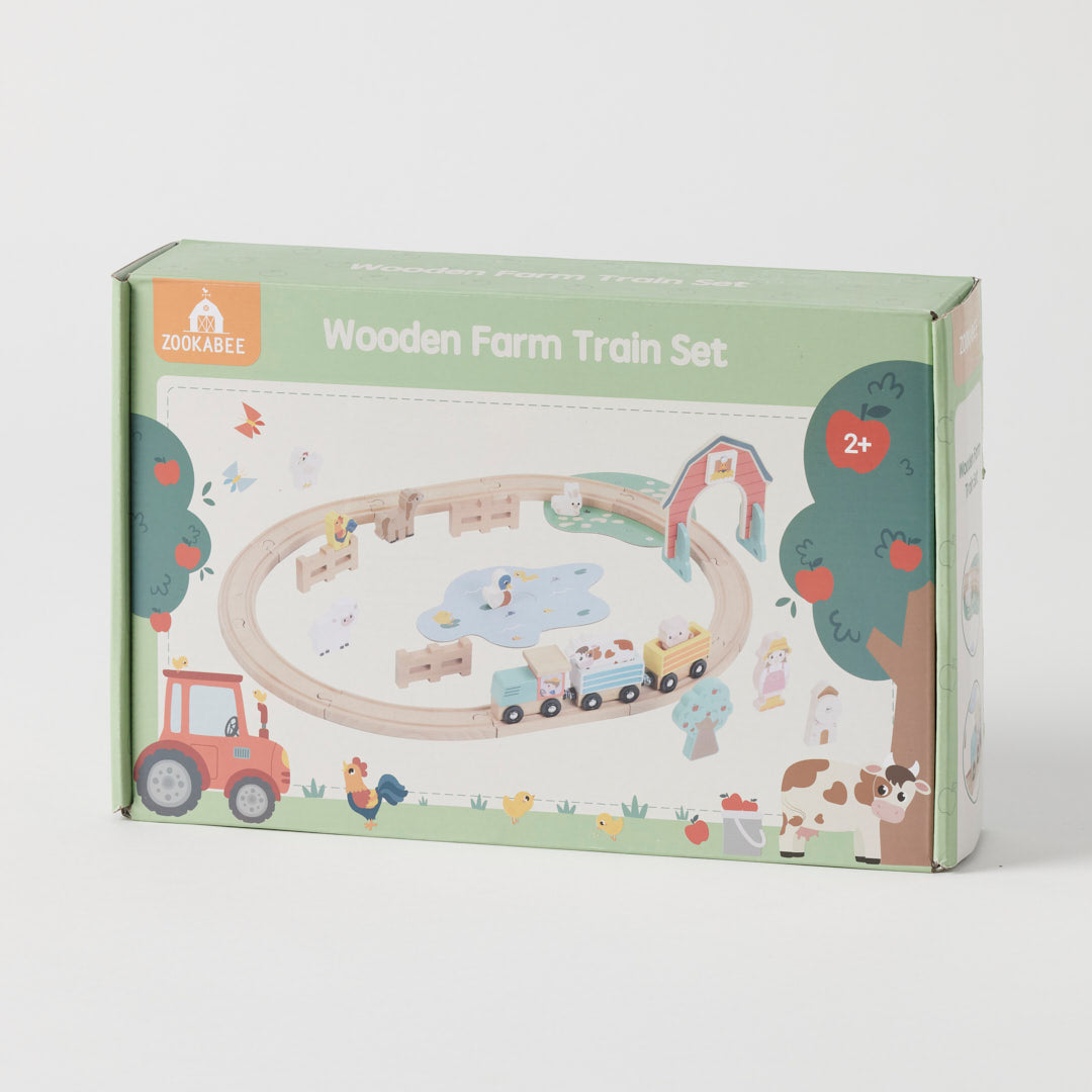 Box of a wooden farm train set with colorful illustrations on a white background
