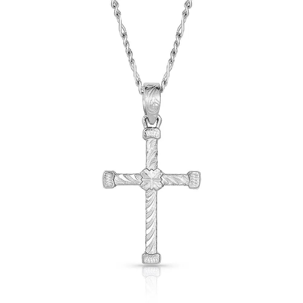 Silver cross pendant necklace on a white background