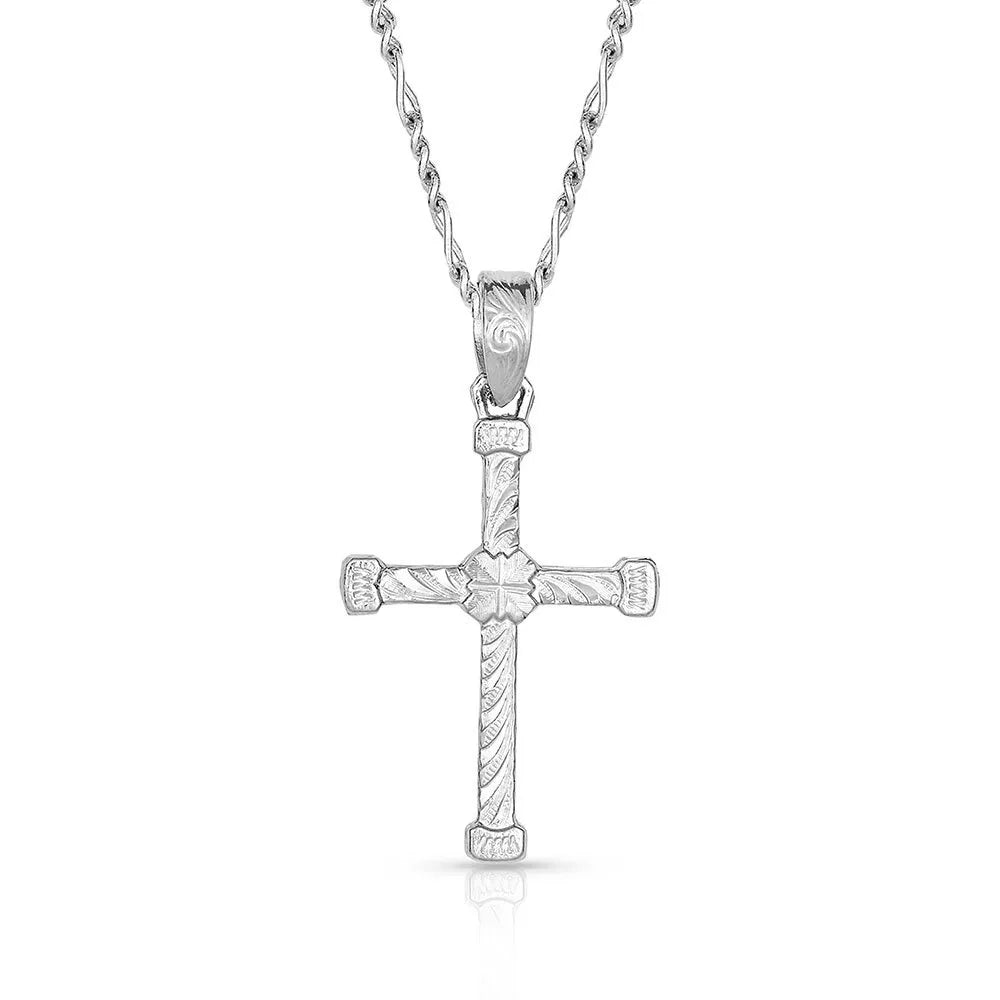 Silver cross pendant necklace on a white background