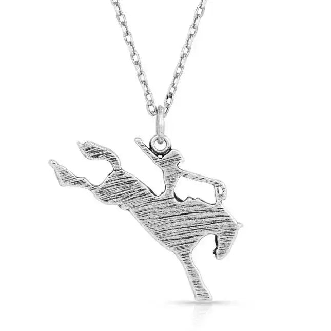 Montana Silversmiths Saddle Bronc Rider Pendant Necklace. A silver-tone pendant necklace featuring a saddle bronc rider figure, displayed against a white background.