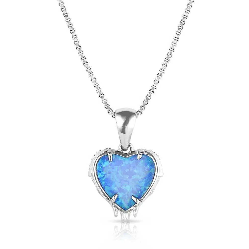 Montana Silversmiths Heart's Flame Opal Necklace. A heart-shaped blue opal pendant necklace with a clear cubic zirconia crystal border, attached to a 20 inch box style chain.