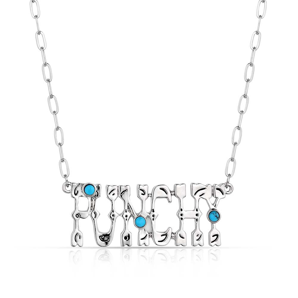 Montana Silversmiths Punchy Charm Turquoise Necklace. A silver-colored necklace with the word 'Punchy' pendant featuring three turquoise stones, attached to a chain.