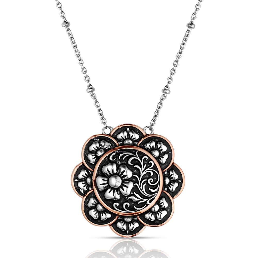 Floral pendant necklace with intricate design on a white background