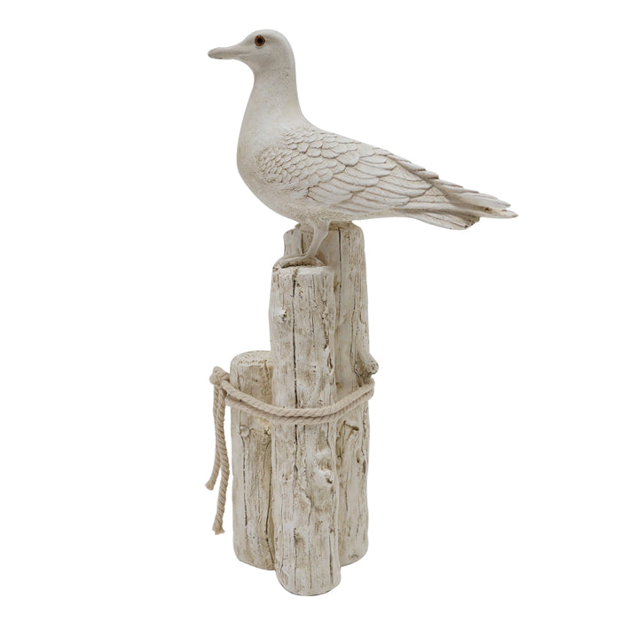 Decorative stone duck perched on a wooden post with rope on a white background