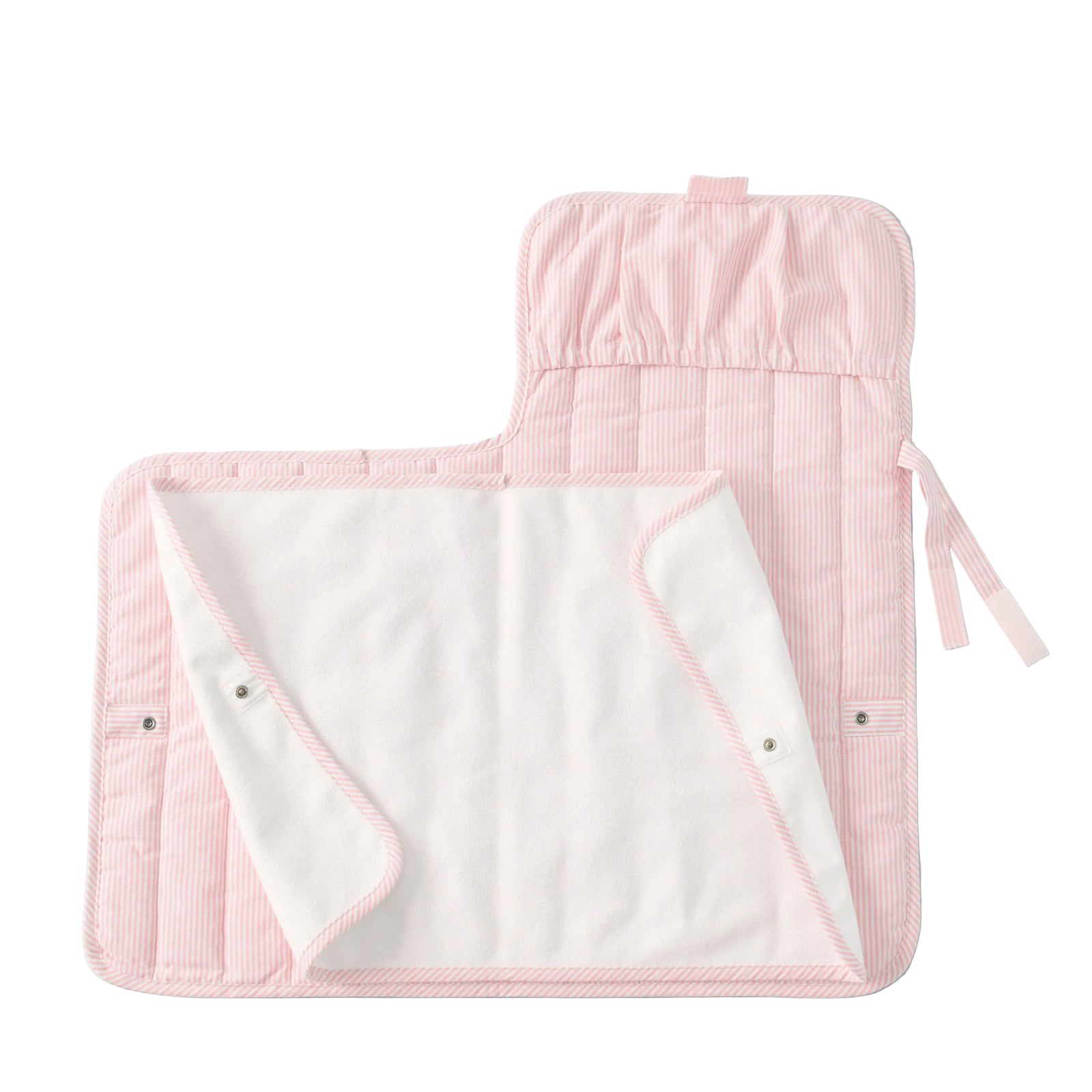Pink striped baby changing pad on a gray background