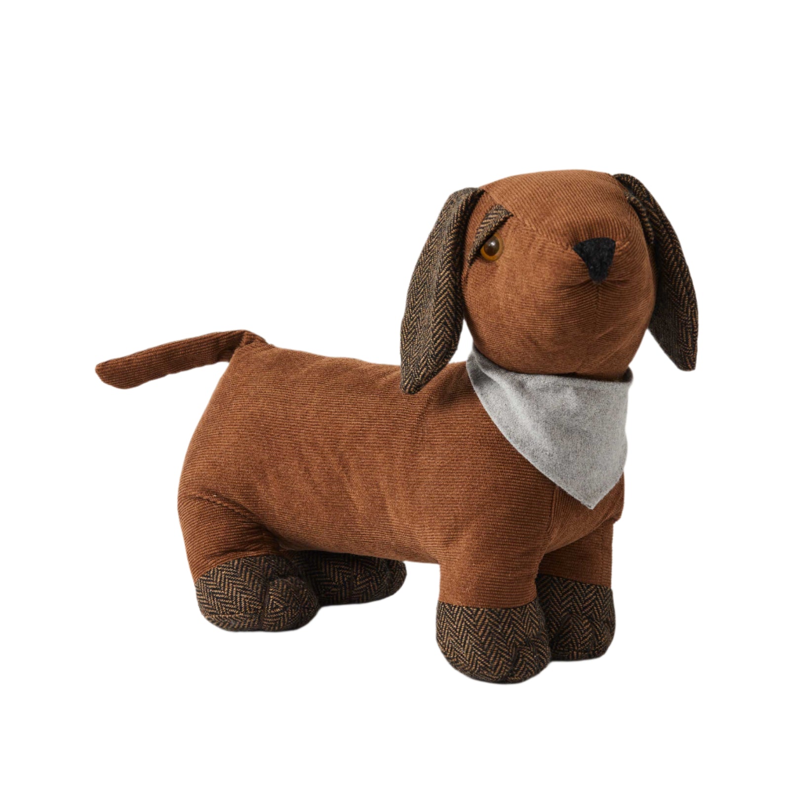 Dolly Door Stop. Brown dog-shaped plush toy with a gray bandana on a white background