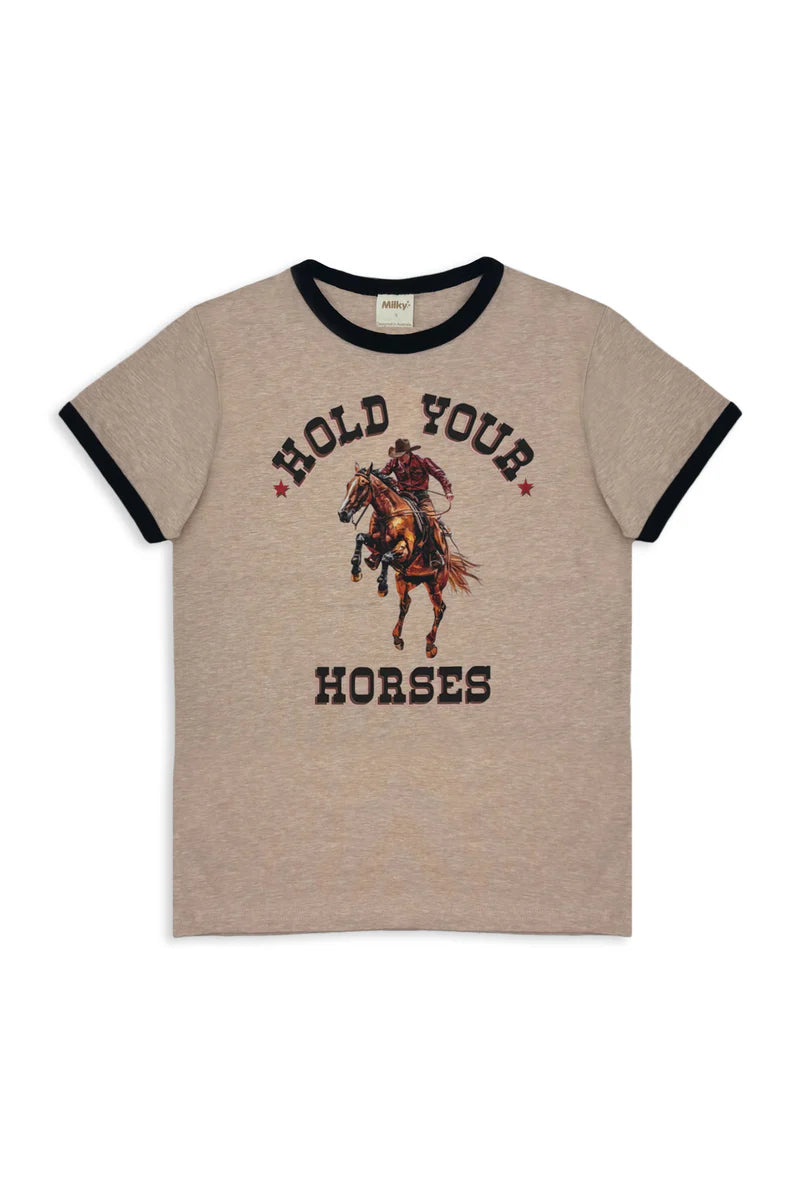 Milky Hold Your Horses Tee. Beige t-shirt with graphic design and text 'Hold Your Horses' on a white background