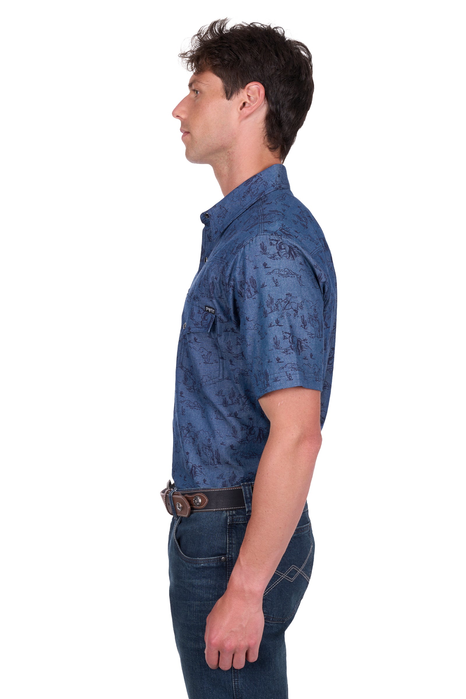 Pure Western Men's Travis S/S Western Shirt. Man wearing a blue patterned shirt and jeans on a white background