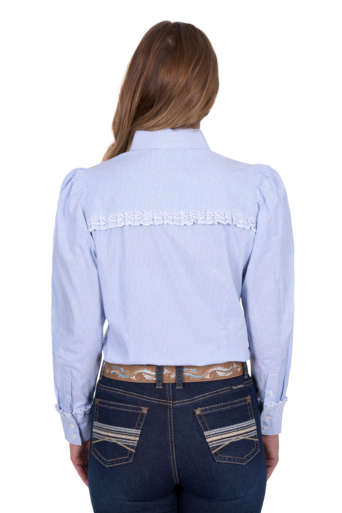 Pure Western Women's Lexi L/S Western Shirt. Woman wearing a light blue shirt with lace details on the back, paired with dark jeans.