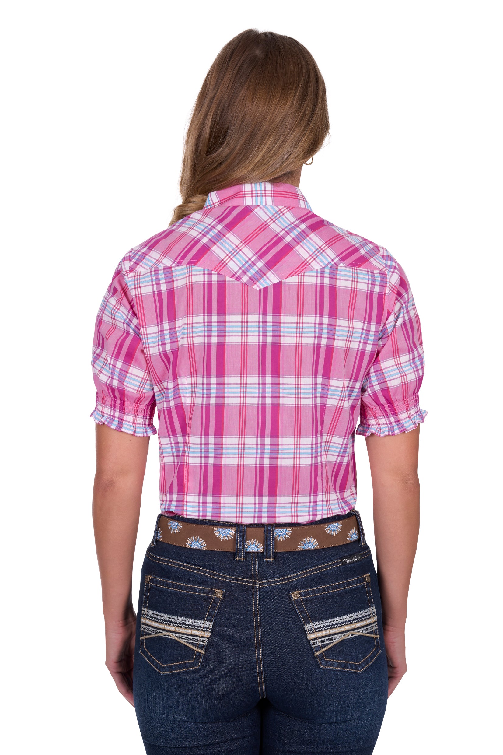 Pure Western Women's Leni S/S Western Shirt. Person wearing a pink plaid shirt and blue jeans on a white background