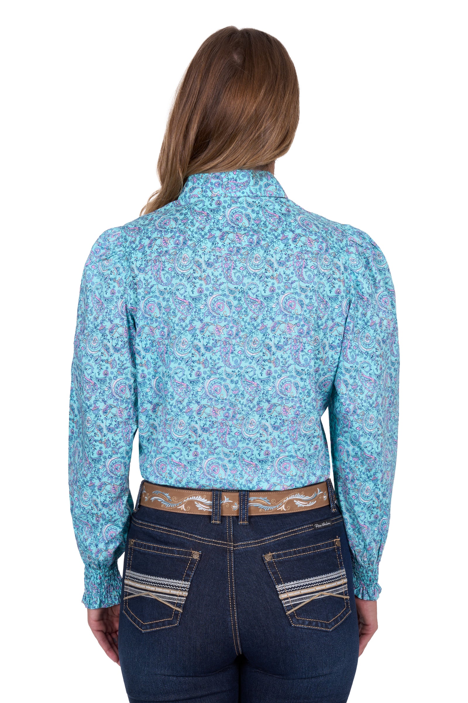 Pure Western Women's Riley L/S Western Shirt. Person wearing a blue floral patterned shirt and dark jeans on a white background