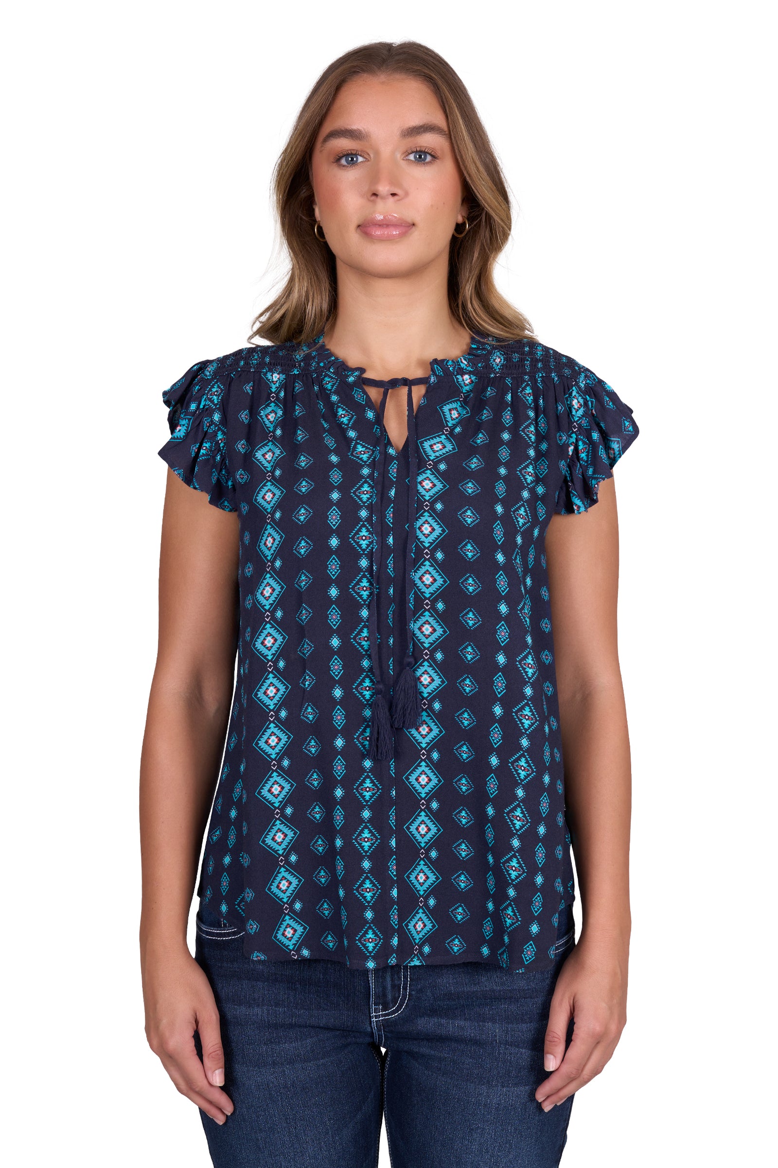 Pure Western Women's Estella Blouse. Woman wearing a blue patterned top on a white background