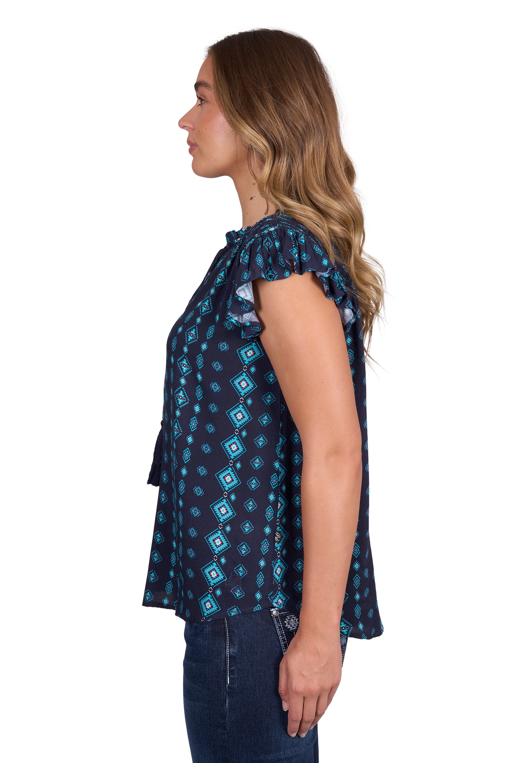 Pure Western Women's Estella Blouse. Woman wearing a blue patterned top on a white background