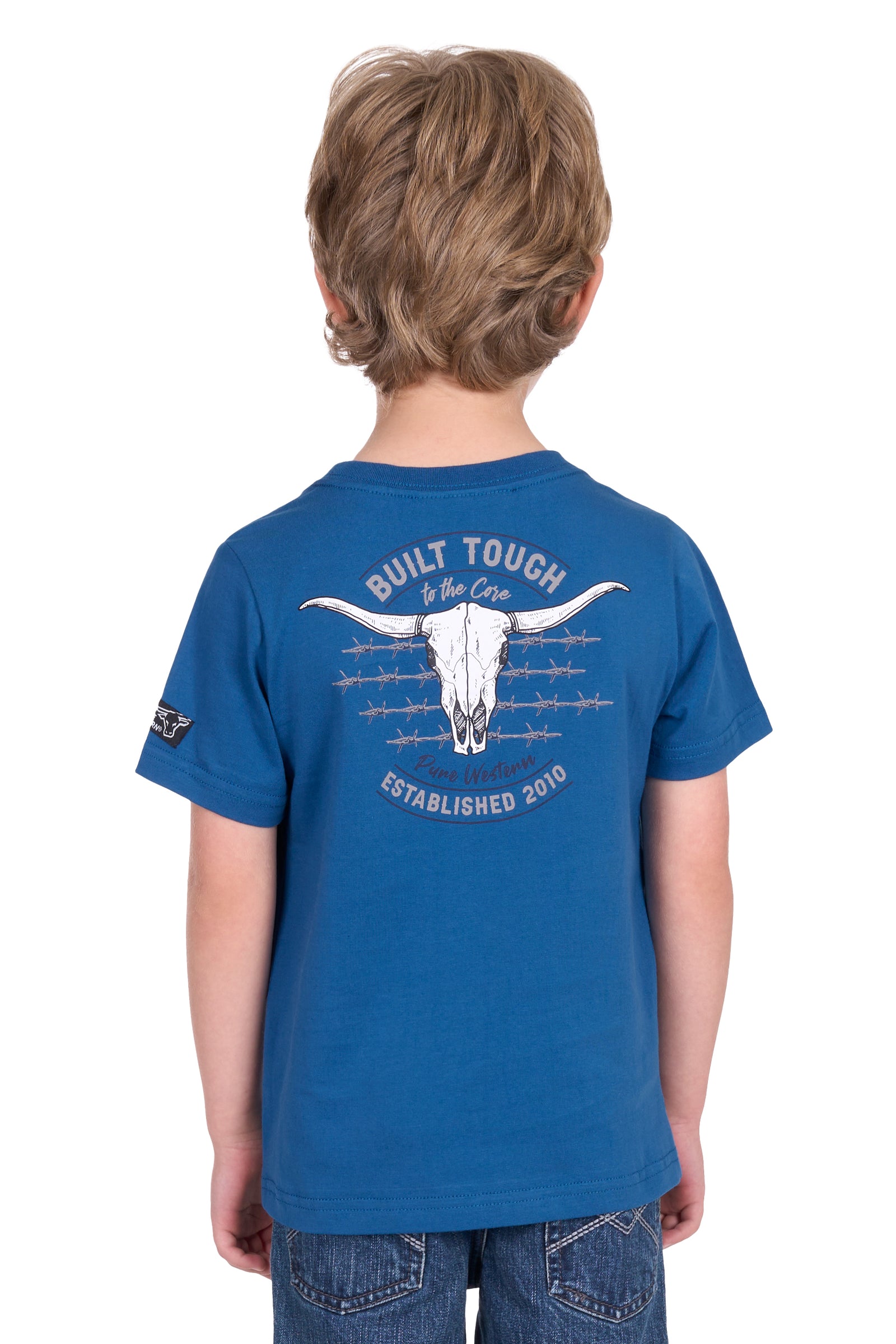 Pure Western Boy's Frank S/S T-Shirt. Young boy wearing a blue t-shirt with a logo on a white background