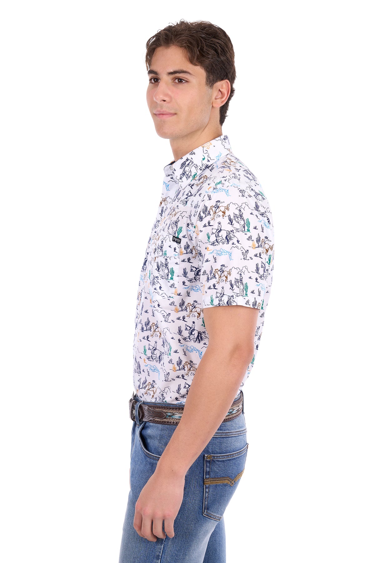 A man shown in profile wearing a short-sleeve button-up shirt with a dense multicolor graphic print on a white base, paired with blue jeans, against a plain white background.