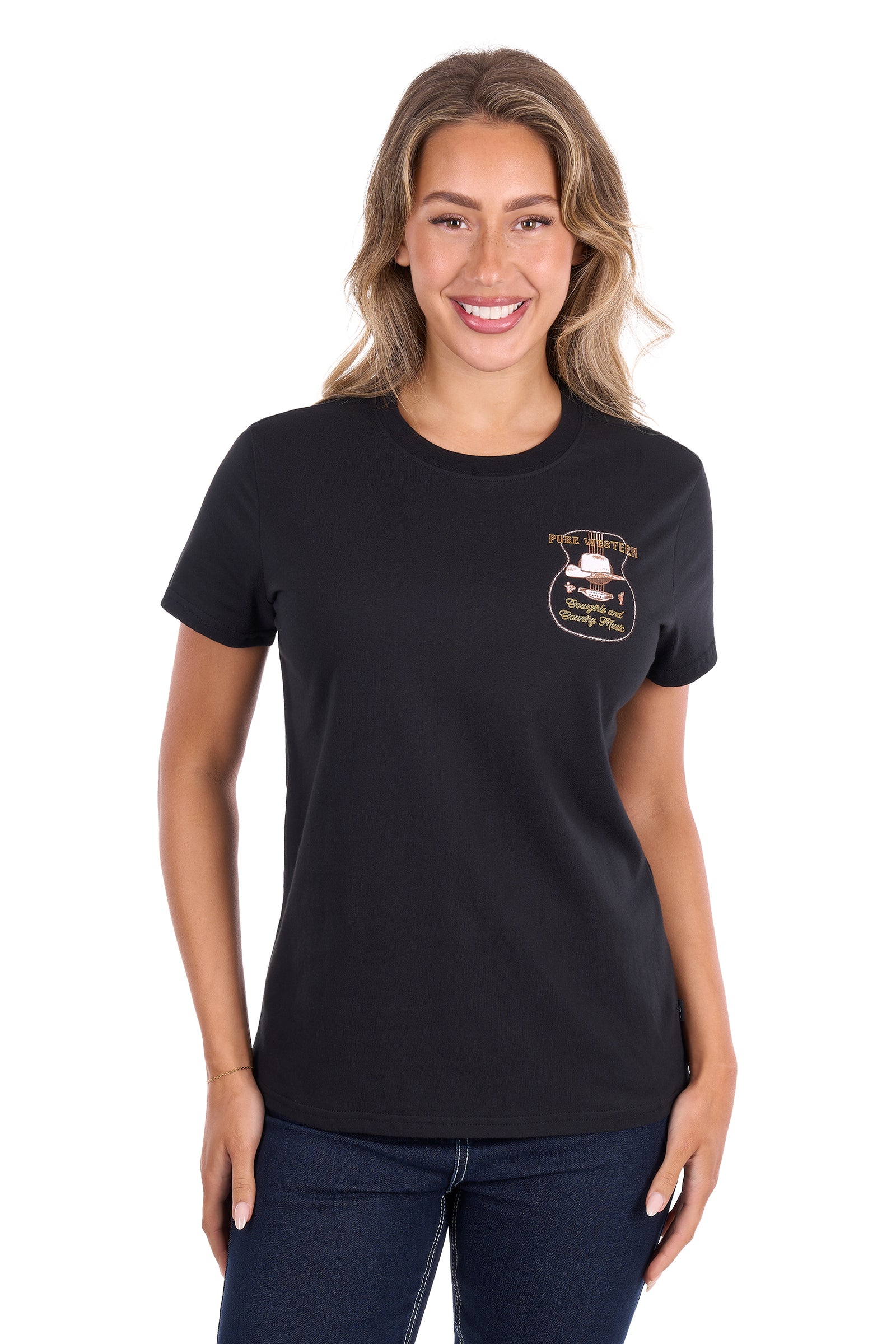 A woman modeling a black short-sleeve crewneck t-shirt with a small embroidered badge graphic on the left chest, paired with dark blue jeans, against a plain white background.