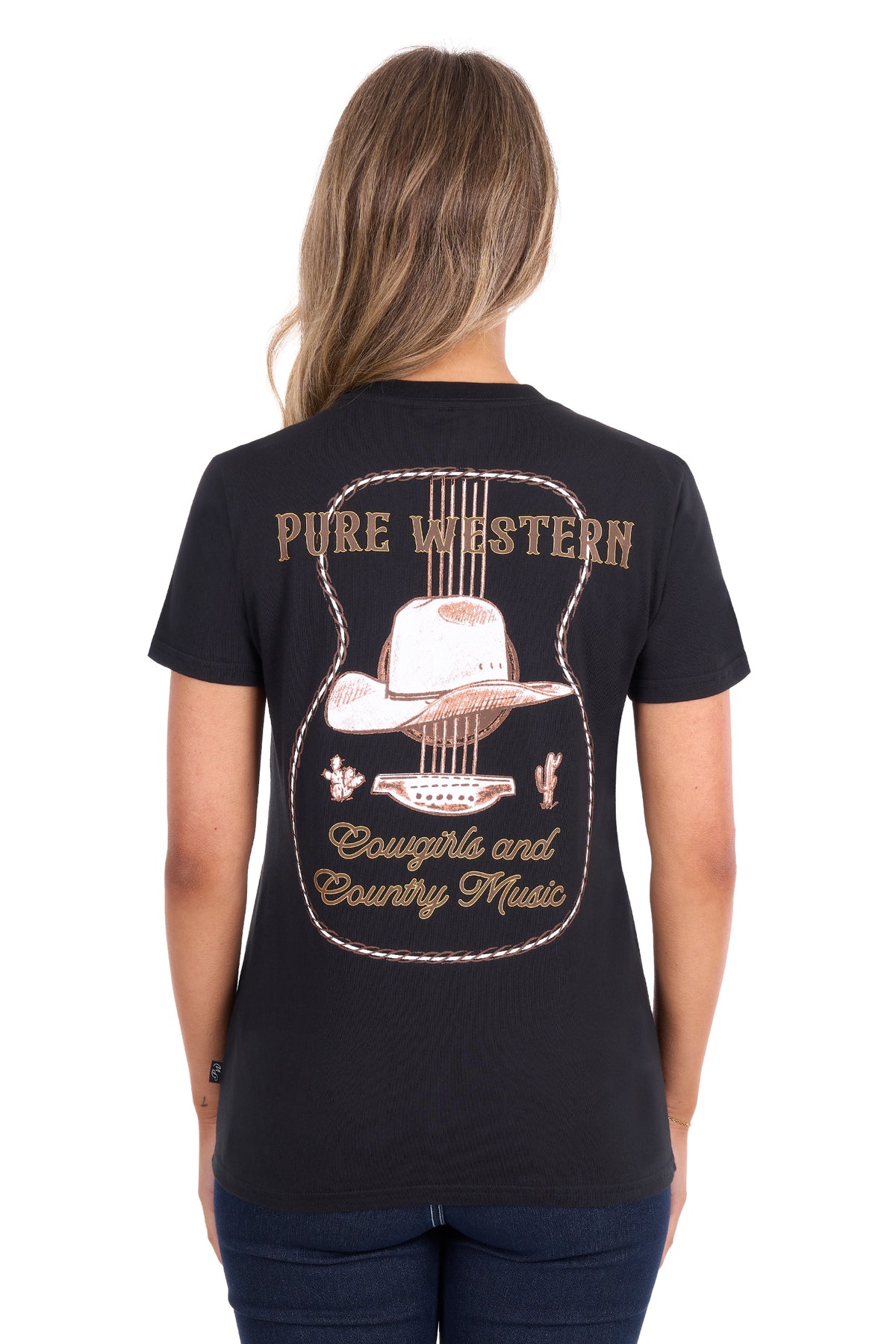 A woman viewed from the back wearing a black short-sleeve t-shirt with a large western-themed graphic on the back. The graphic features a guitar outline, a cowboy hat, and the words 'PURE WESTERN' and 'Cowgirl and Country Music' in tan and light brown lettering.