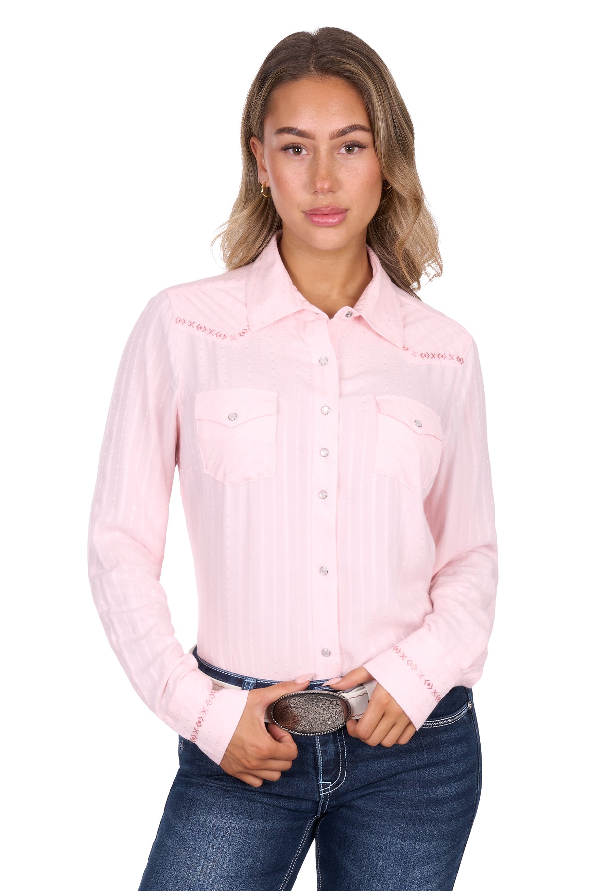 Woman wearing a pink shirt with a brand logo on a white background