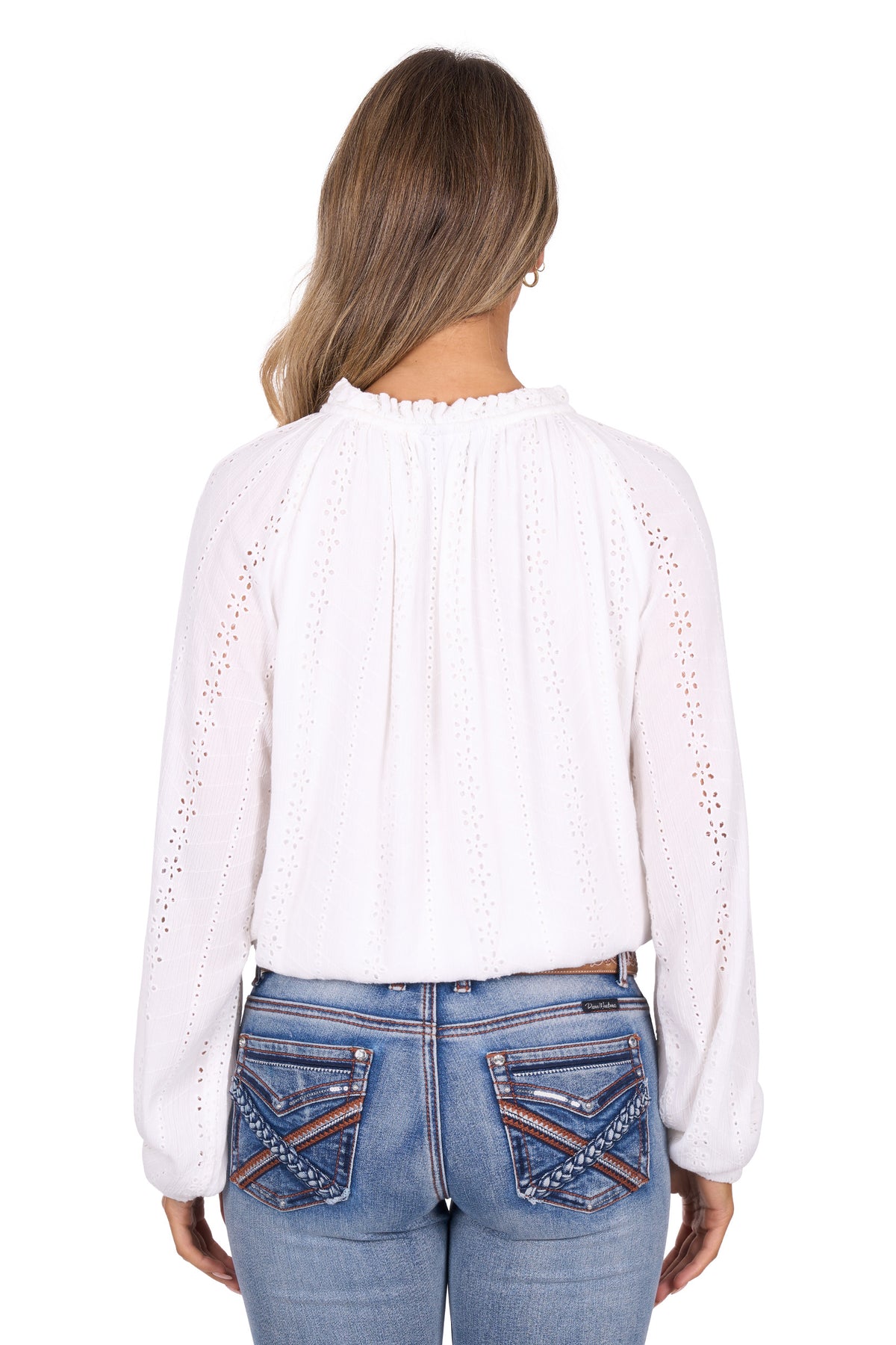 White blouse with cut-out details worn by a person on a white background