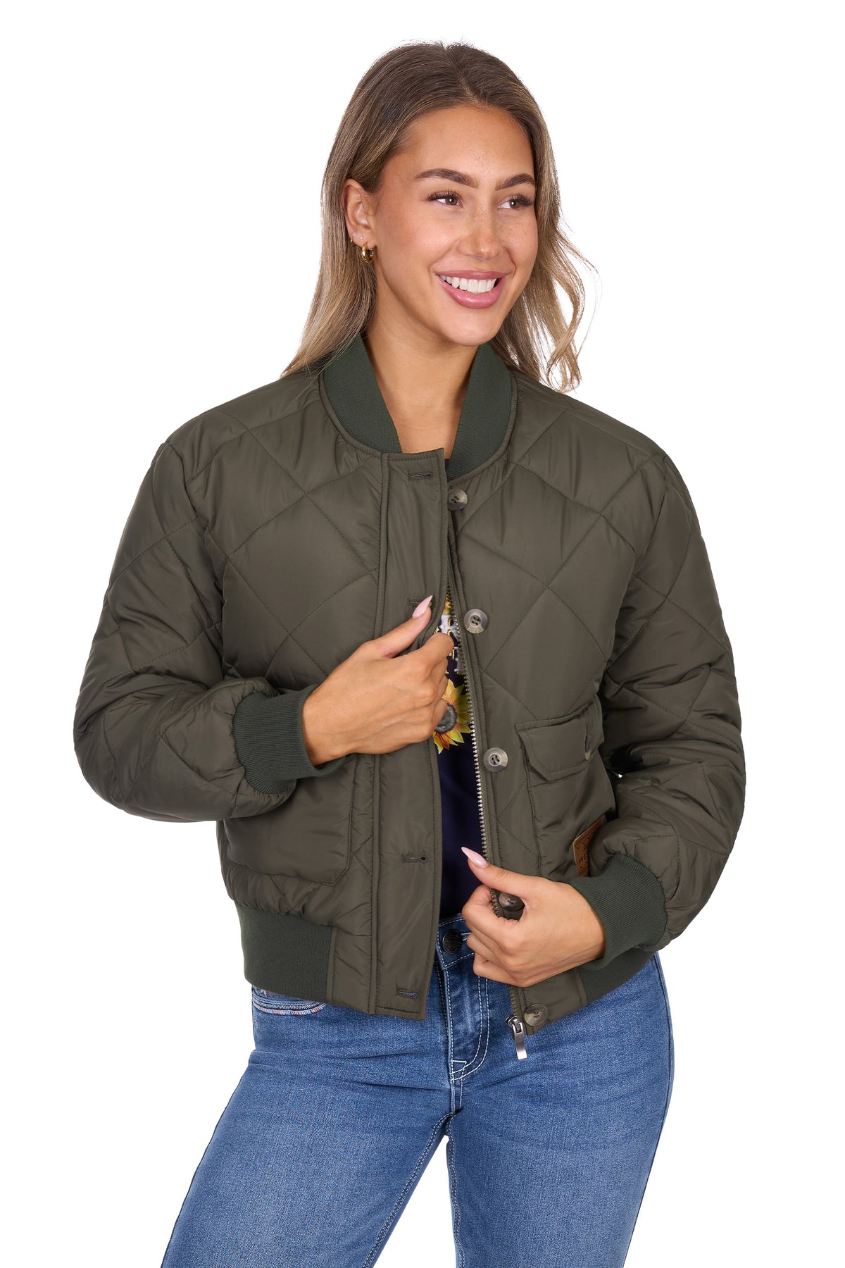 Woman wearing a green quilted jacket on a white background