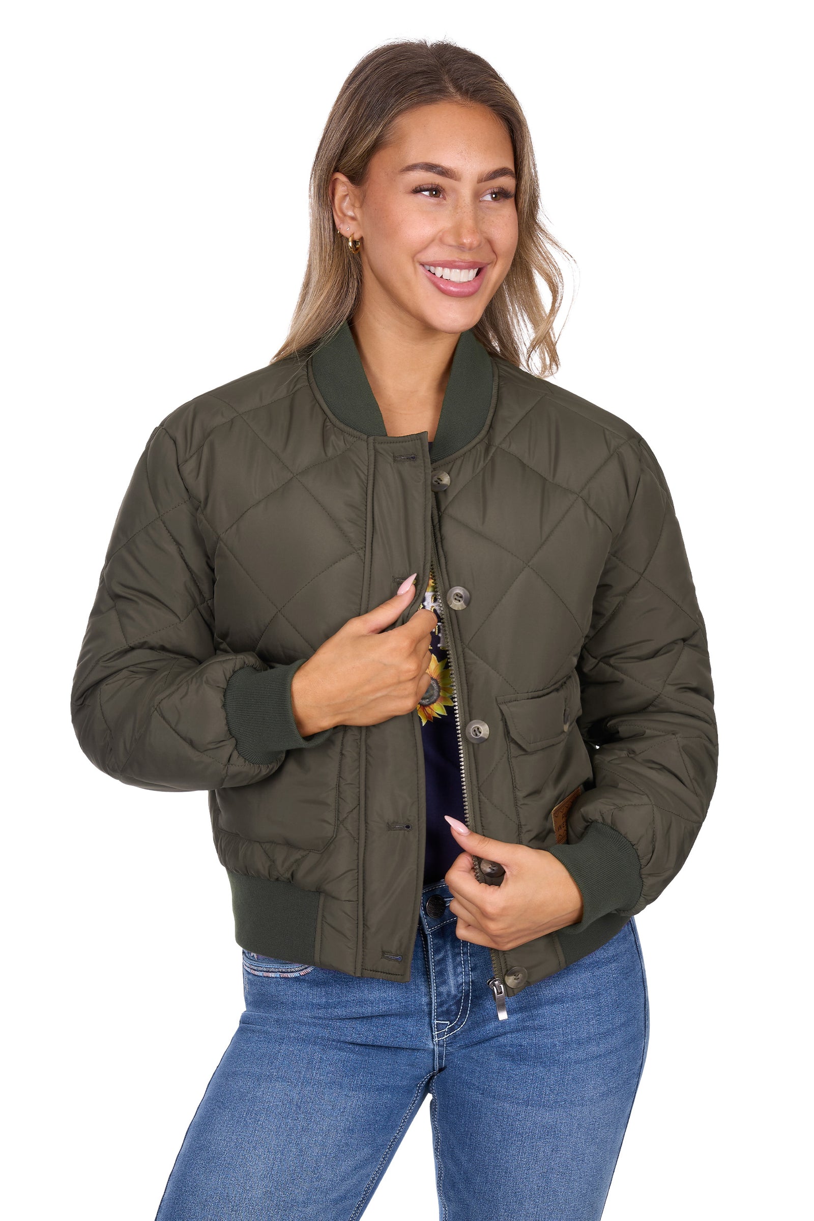 Woman wearing a green quilted jacket on a white background
