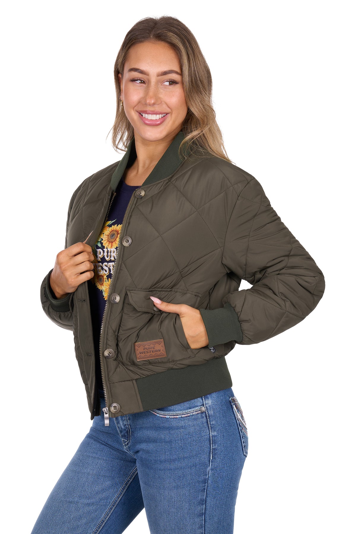 Woman wearing a green quilted jacket on a white background