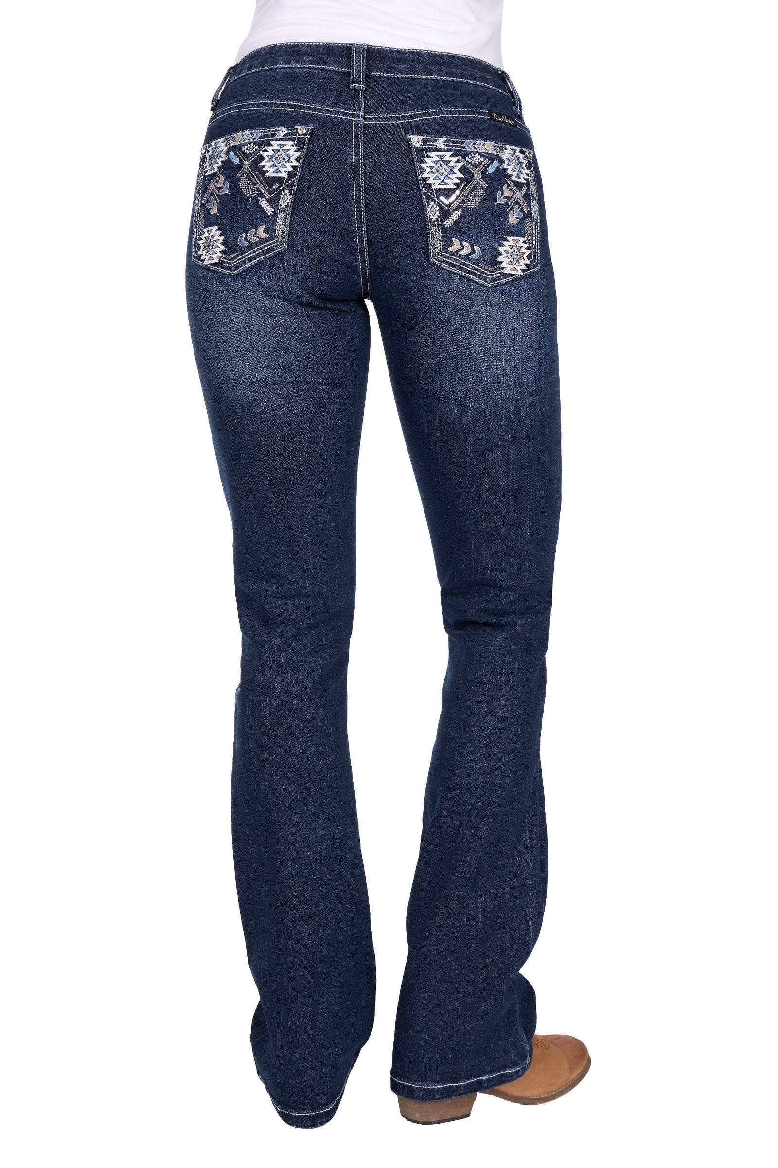Dark blue jeans with floral embroidery on the back pockets against a white background
