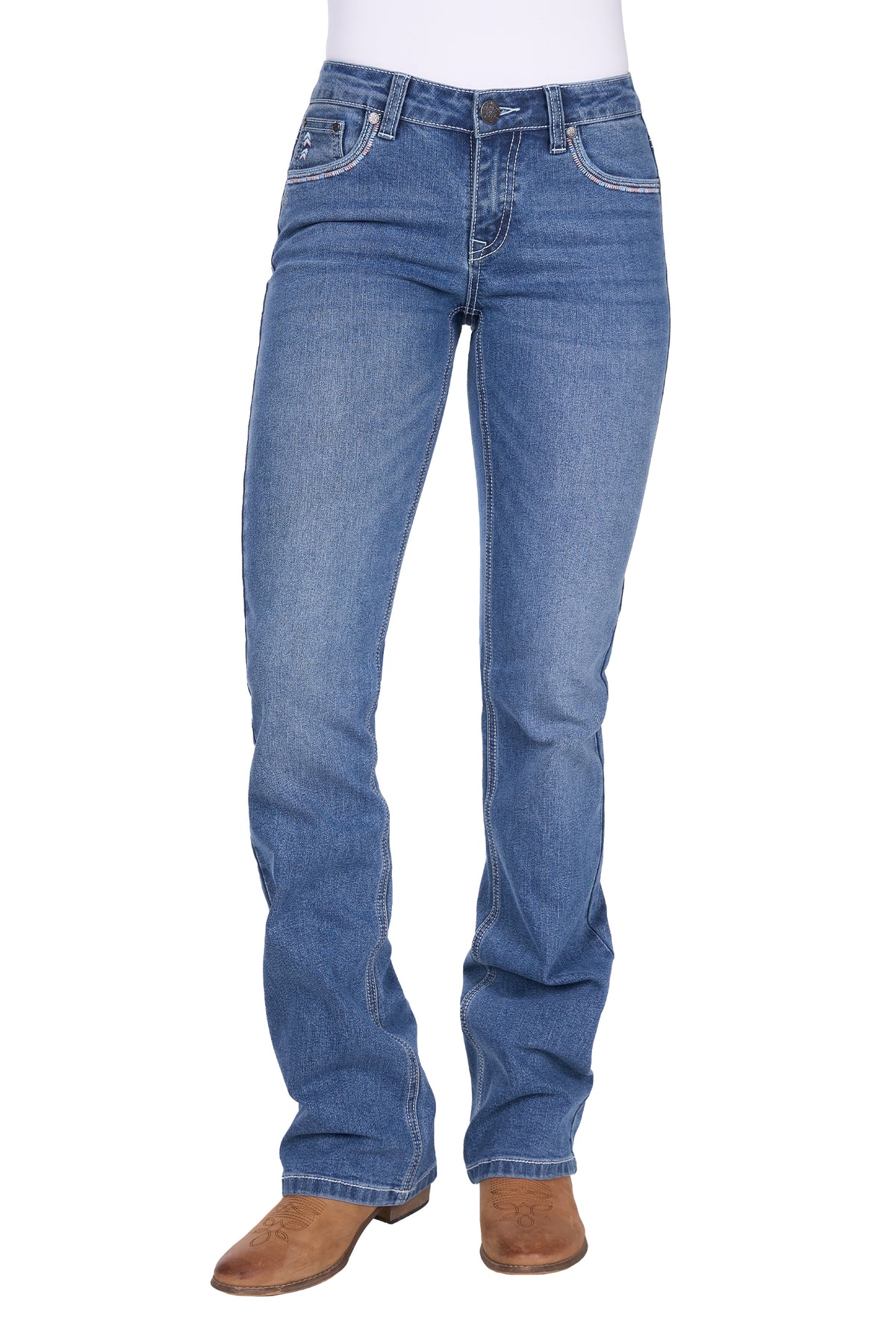 Blue jeans worn with brown boots on a white background