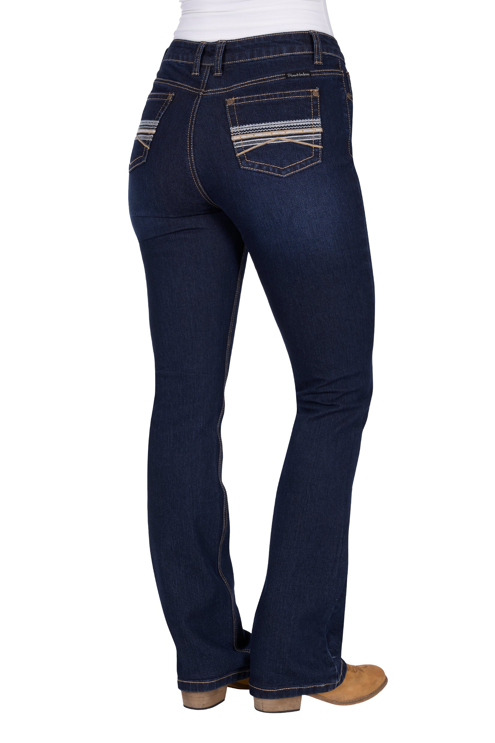 Pure Western Women's Ida High Rise Boot Cut Jean. Dark blue jeans on a white background
