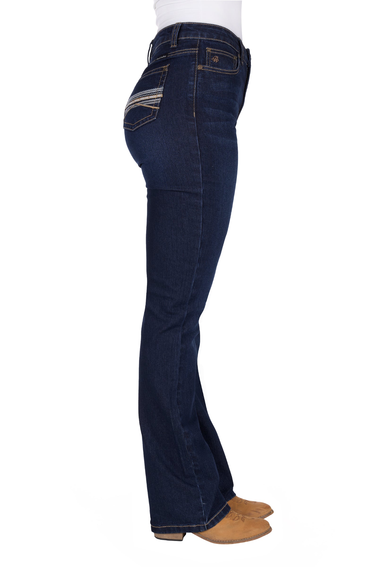 Pure Western Women's Ida High Rise Boot Cut Jean. Dark blue jeans worn by a person on a white background