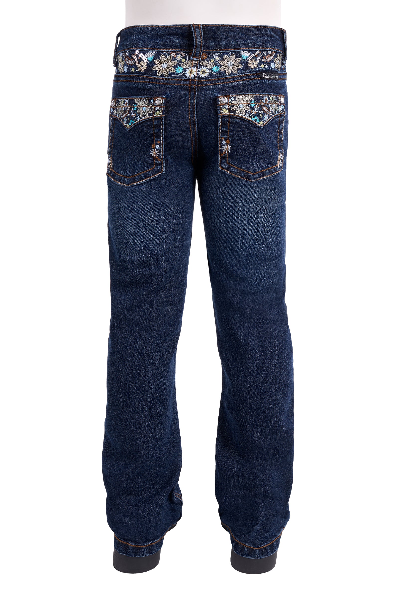 Back view of dark blue denim jeans with ornate floral embroidery and rhinestone embellishment on the back pockets and waistband, shown on a white background.