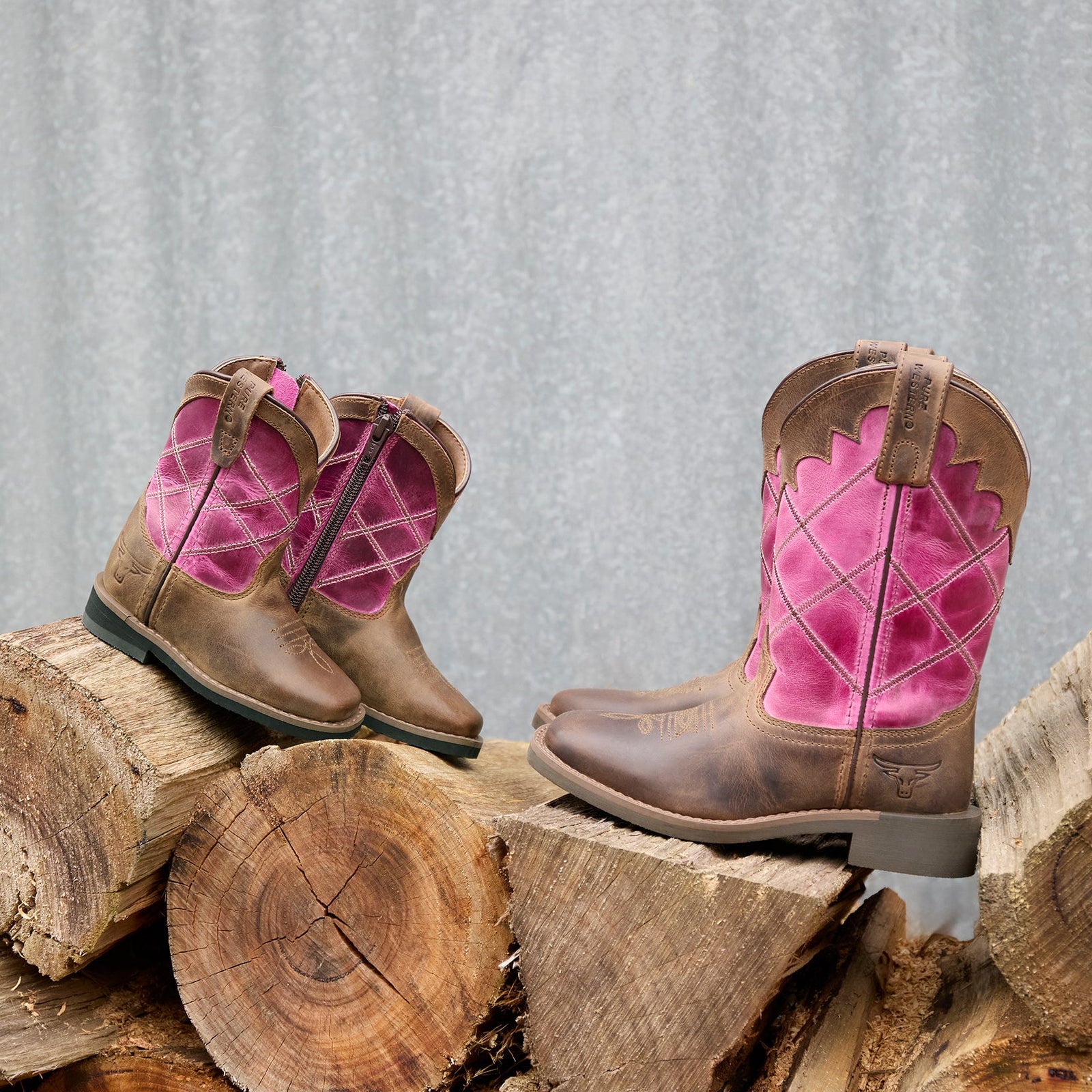 Brown and pink cowboy boot on a white background