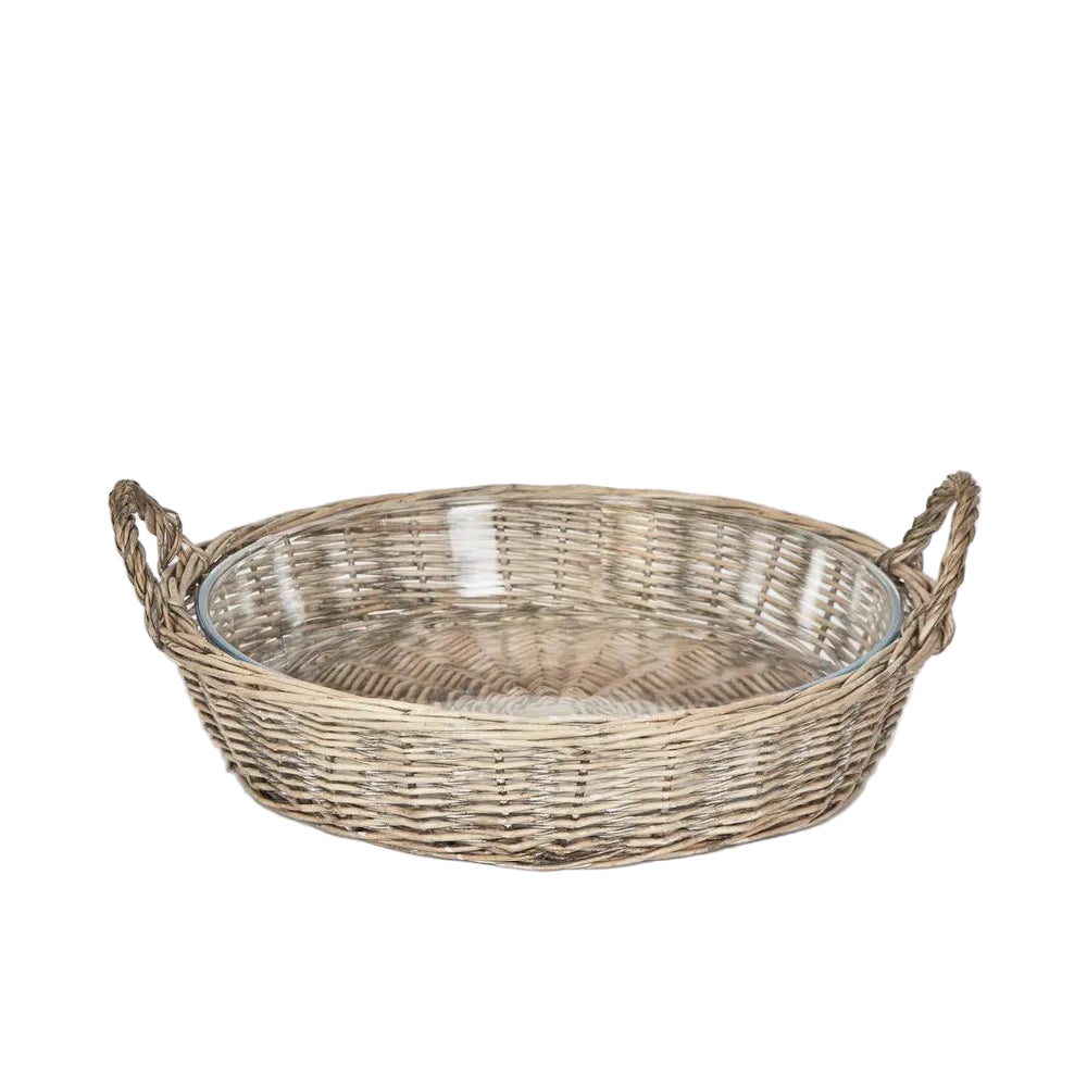 Round Basket with Glass Dish. Wicker basket with handles on a light gray background
