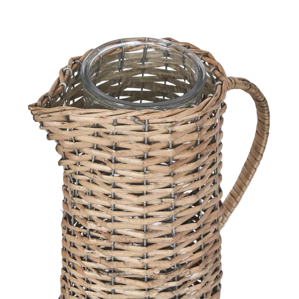 Large Jug with Glass Insert. Wicker pitcher with glass container on a white background
