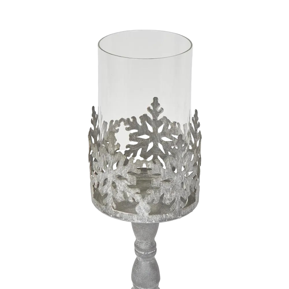 Snow Candle Holder Zinc. Decorative candle holder with snowflake design on a white background