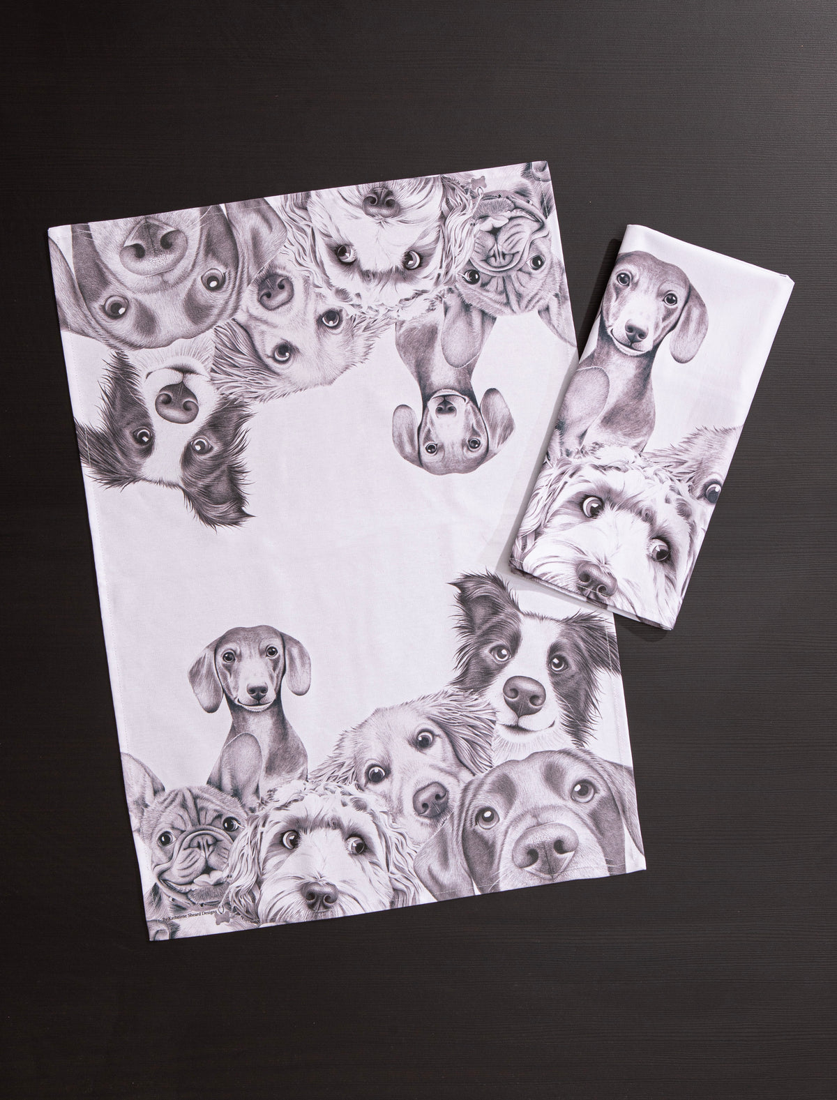 Set of two greeting cards with black and white illustrations of dogs on a dark background