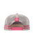 Roper Trucker Cap Cattle Tag. Pink trucker hat with a brown leather patch on a white background