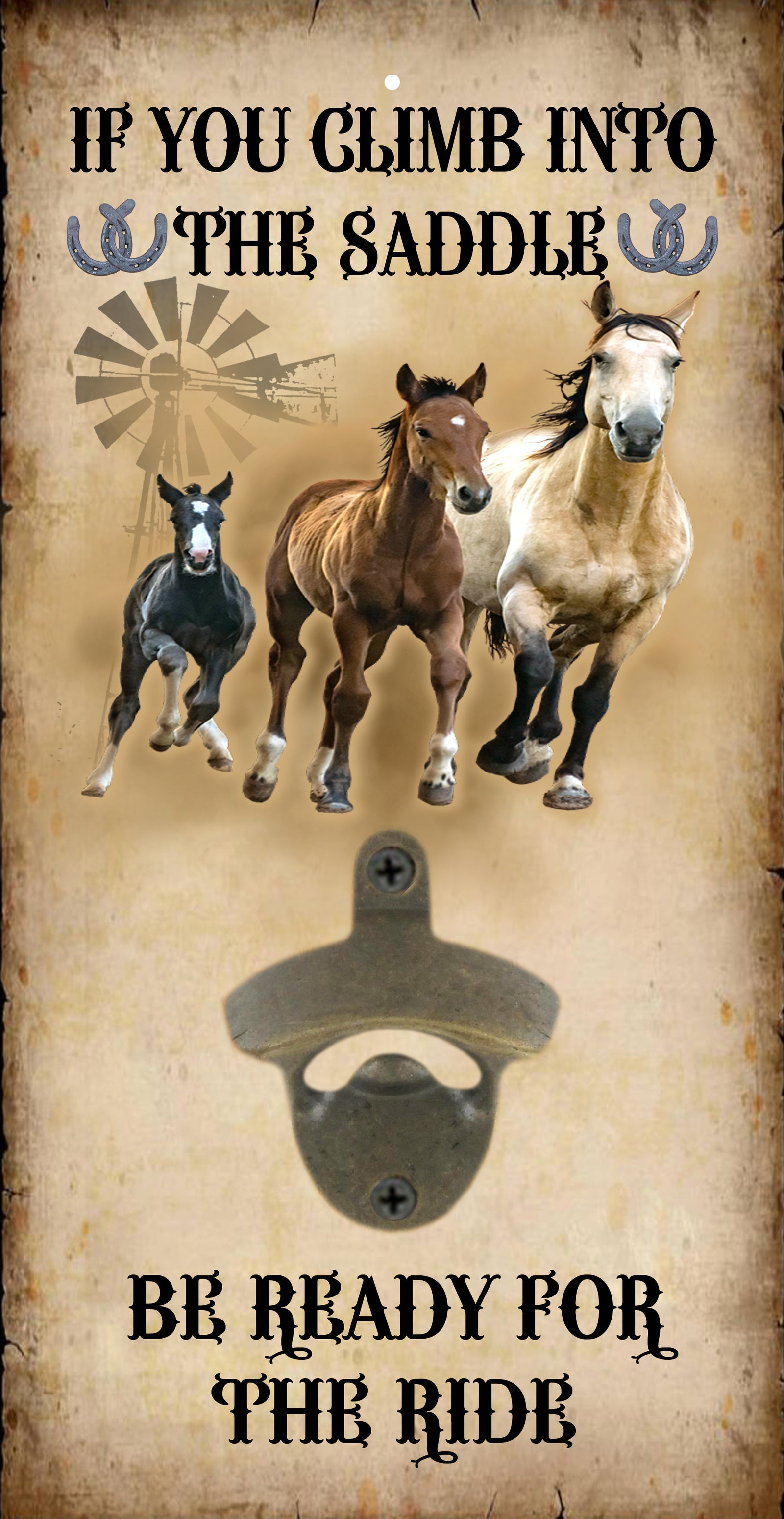 A rustic decorative sign with a bottle opener mounted in the center. The sign features three running horses (one black, one brown, one white), a windmill graphic, and the text 'IF YOU CLIMB INTO THE SADDLE' at the top and 'BE READY FOR THE RIDE' at the bottom, all on a distressed beige background.