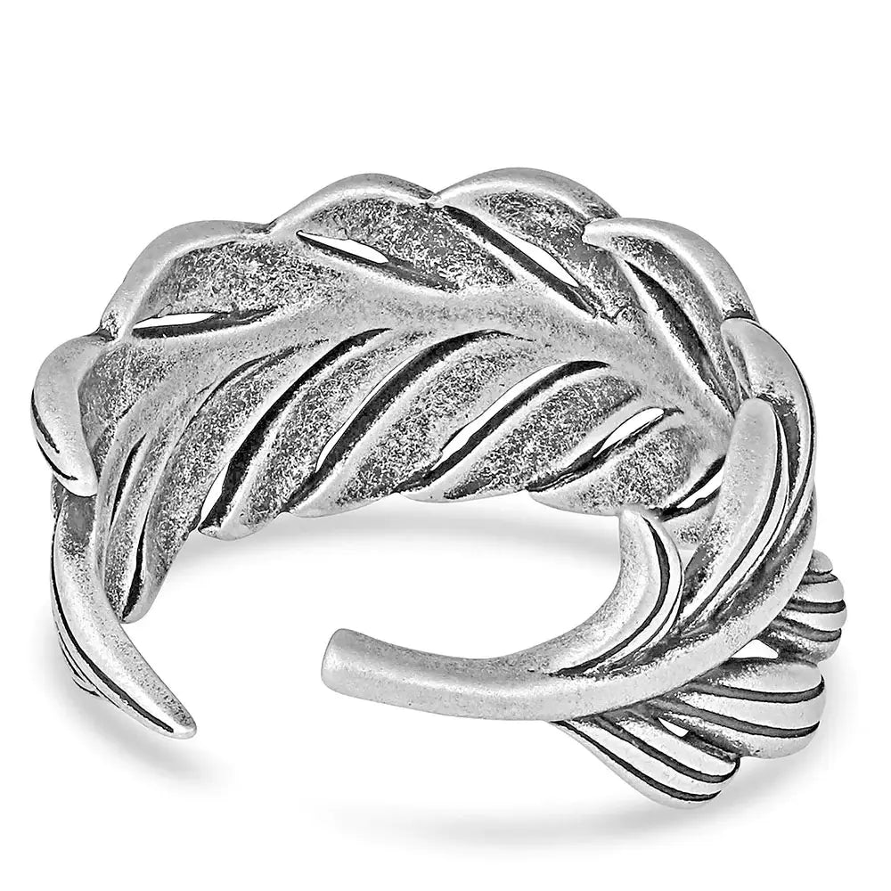 Montana Silversmiths The Frayed Singleton Wrap Ring. An adjustable silver-colored ring with a carved feather design and hand-painted black details.