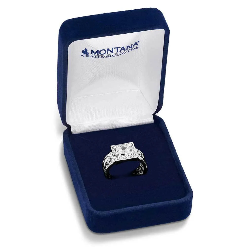 Diamond ring in a blue box with 'Montana Silversmiths' branding on a white background